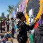Youth participating in a community art program in St Louis creating murals 85x85